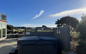Hot tub in side patio area.