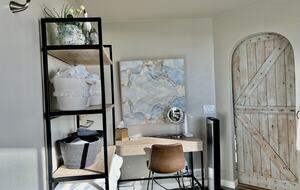 Primary bedroom with vanity.