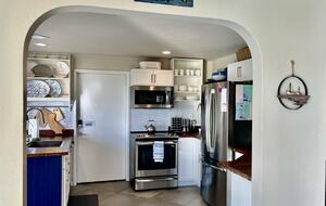 Entrance of kitchen at dining room.