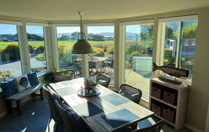 Dining room comfortably seats 6 or up to 10 with benches.