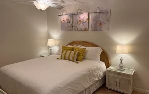 Master bedroom with king bed and attached full bathroom