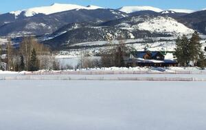 Front of home from top of meadow with Lake Dillon in backgrd