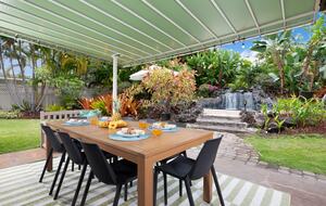 Lanai view of pool, waterfall & backyard