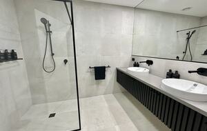 2nd of 4 bathrooms with batten dual basin vanity