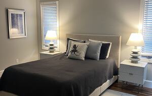 Master bedroom with glass doors to screened porch