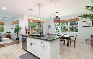 Kitchen with island open to living