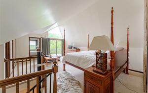 Primary Bedroom with private deck facing river and pool