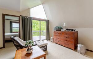 Primary Brm seating with picture window and door to Brm #3