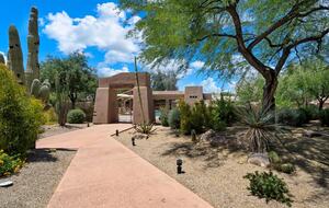 Secured entrance to community pool is at end of street