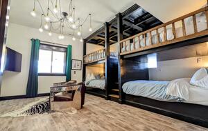 Four queen bunks with private reading lights and smart TV