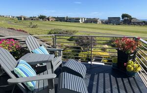 Seating for two at primary balcony.