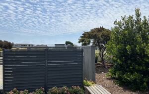 Privacy screen with planters at hot tub.