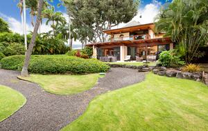 View of the backyard/downstairs and upstairs lanai