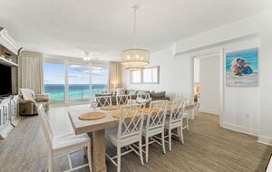 8 seats at dining table with view of ocean