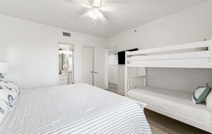 King bed with bunk beds, bay view and on-suite bathroom