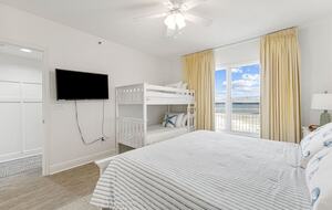 King bed with bunk beds, bay view and on-suite bathroom
