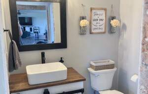 Powder room near kitchen