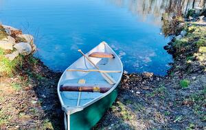 Canoeing on the other side of the pond