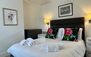 Bedroom 2 with original artwork