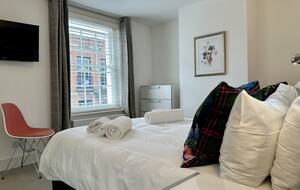 Bedroom 2 with wall-mounted Smart TV and Kingsize bed