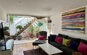Living room leads to the garden via steps