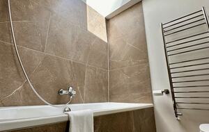 Enjoy a view of the sky from the bathtub