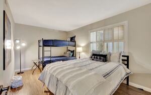 Bunk bed room with a queen bed.