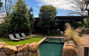 View to the pool from the fireplace