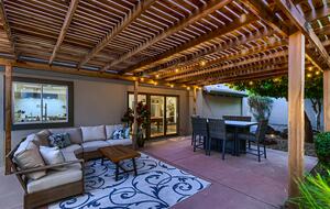 Outdoor seating area and dining table with fire pit