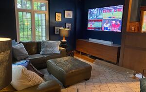 Cozy den with large screen smart TV