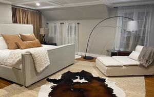 Master bedroom with plush king mattress