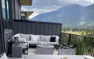 Main floor deck with fire pit, seating ,dining and BBQ.