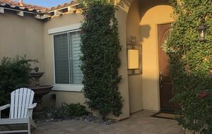 Courtyard entry with outdoor fireplace and sitting area