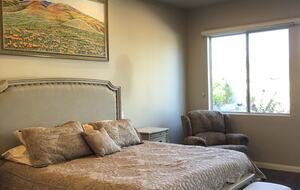 Primary bedroom with king bed, walk-in closet, ensuite