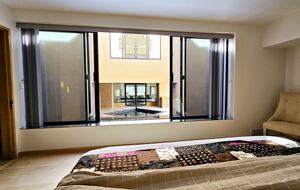 Bedroom 2 with opening to fountain pool