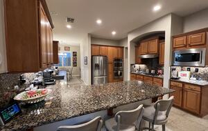 Kitchen, barstools, gas range, double ovens