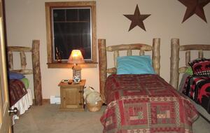 Bedroom 1 with three full size beds