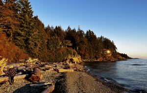 House from across the beach (shining light)