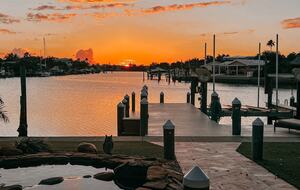 Charming Beach Cottage Steps from St. Pete Beach with Lagoon Pool & Dock - St. Pete Beach, Florida
