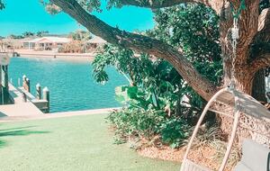 Charming Beach Cottage Steps from St. Pete Beach with Lagoon Pool & Dock - St. Pete Beach, Florida