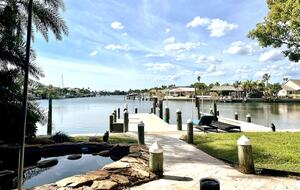 Charming Beach Cottage Steps from St. Pete Beach with Lagoon Pool & Dock - St. Pete Beach, Florida