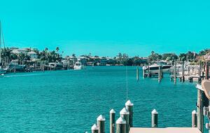 Charming Beach Cottage Steps from St. Pete Beach with Lagoon Pool & Dock - St. Pete Beach, Florida