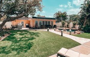 Charming Beach Cottage Steps from St. Pete Beach with Lagoon Pool & Dock - St. Pete Beach, Florida