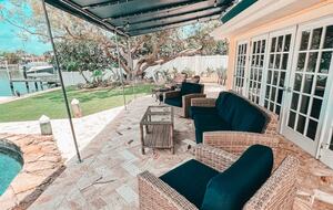 Charming Beach Cottage Steps from St. Pete Beach with Lagoon Pool & Dock - St. Pete Beach, Florida