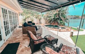 Charming Beach Cottage Steps from St. Pete Beach with Lagoon Pool & Dock - St. Pete Beach, Florida