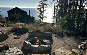 Firepit built into cliffside with views of Ocean