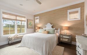 Downstairs primary bedroom with lake and golf course view.