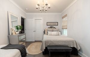 Upstairs center bedroom with queen bed, and twin bed