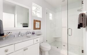 Upstairs center bedroom offers spacious custom tiled shower