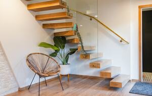 Custom floating stairs take you to 3 additional bedrooms